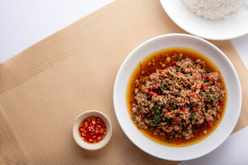 Rice topped with stir-fried pork and basil. Stir fried basil. on wooden table background. top ten thaifood menu