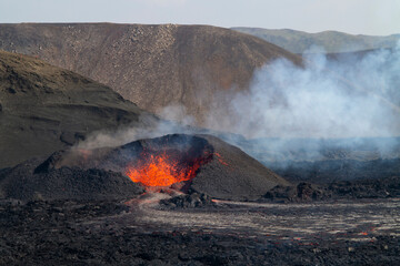 MERADALIR, ICELAND - AUGUST 14, 2022: A volcanic eruption has started at Fagradalsfjall in the...