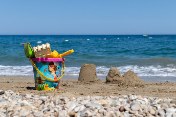 bucket and spade on beach