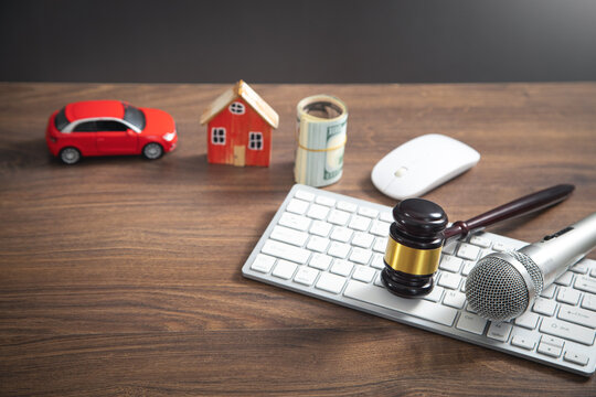 Judge gavel, house, money, car, microphone, computer keyboard. Concept of Auction