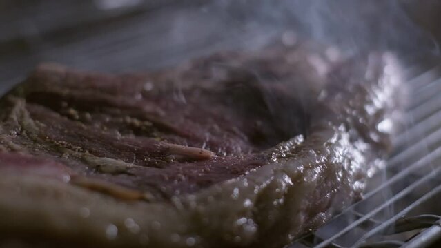 Close-up of ready well-done stake on the grill