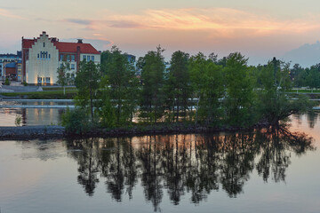 Fototapeta na wymiar Summer white night after sunset in Finnish Joensuu near Pielisjoki river.