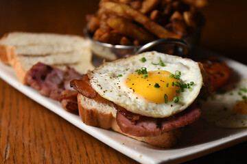 close up on fried egg on a toast 