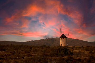 Traditional spanish windmill sunset