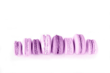 French purple macaroons on white isolated background. Bold hues for seasonal projects and basis...