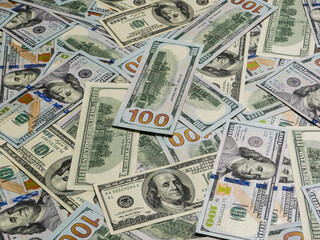 Group of money stack of 100 US dollars banknotes.