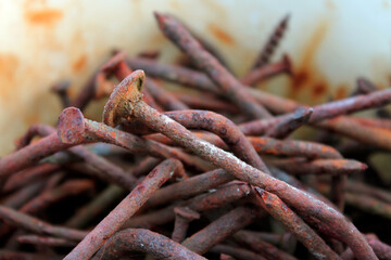 rusty nails, a handful of rusty nails, rust, metal corrosion, background old nails closeup with blurred background