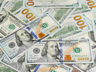 Large pile of hundred dollar bills in background view.