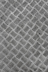 Pattern of old metal diamond plate. Metal surface with diamond plate texture. The diamond steel metal sheet.