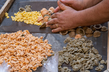 Typical italian pasta orecchiette of different color and freshly handmade in Bari Puglia Italy