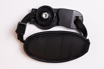 black leather camera strap on white background
