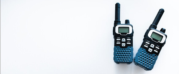 Two radio walkie-talkies for transmitting a signal over distances. Radios of rescue services. Intercom devices on white isolate.