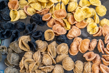 Typical italian pasta orecchiette of different color and freshly handmade in Bari Puglia Italy