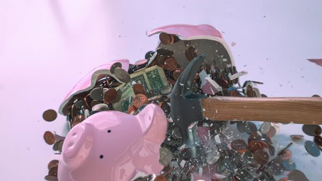 Smashing a pink ceramic piggy bank full of change in 1000fps slow motion