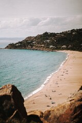Vertical shot of people relaxing on Bolonia beach in Tarifa, Spain