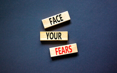 Face your fears and support symbol. Concept words Face your fears on wooden blocks. Beautiful black...