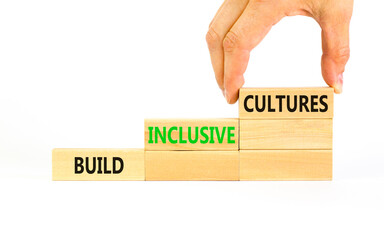 Build inclusive cultures symbol. Concept words Build inclusive cultures on wooden blocks....
