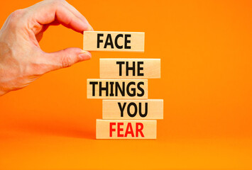 Face the things you fear symbol. Concept words Face the things you fear on wooden blocks on a...