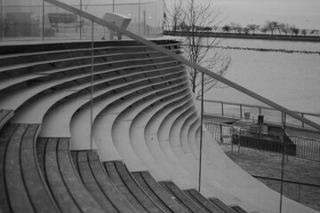 Grayscale shot of an amphitheater stairs