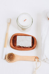 Eco friendly cosmetics. Candle, washing brush, toothbrush, handmade soap. Hygge, autumn cozy mood, comfort concept.