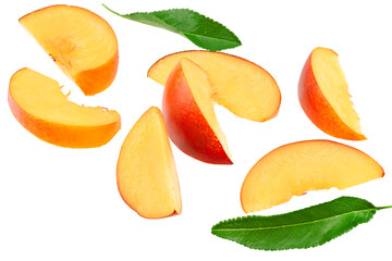 flying cuts of peach fruit with green leaf isolated on white background. clipping path