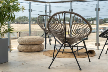 A cozy place to relax and unwind. Round wicker chairs, stylish interior items