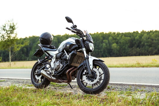 Stupino, Russia - AUGUST 17, 2022 
motorcycle yamaha mt-07 on country road in summer