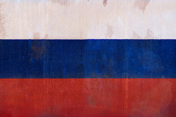 Full frame front view photo of a weathered flag of Russia painted on a rusty, grunge and dirty wall.