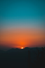 Obraz premium sunset in the mountains golden hour teal and orange travel adventure pakistan 