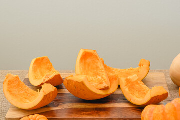 Taking out pumpkin seeds from fresh row orange pumpkin. Making pumpkin puree, step by step recipe