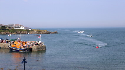 Fototapeta premium Lifeboat at Cemaes Bay, Anglesey, Wales, with more boats arriving at speed.