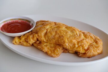 Closeup omelette crab on white dish