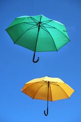 Fototapeta na wymiar cheerful parasols against the sky - fröhliche Regenschirme in der Luft