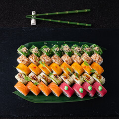 tasty sushi on the black background