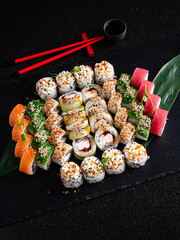 tasty sushi on the black background