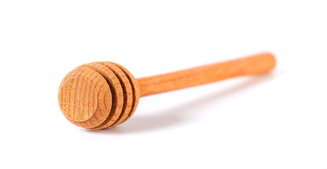 wooden honey spoon isolated on white background