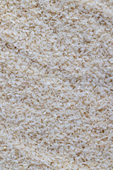 a pile of scattered white rice on the kitchen table