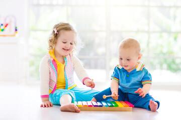 Child with music instruments. Art for kids.