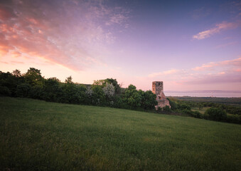 Sunset over the medieval ruins of a temple at lake Balaton, Hungary