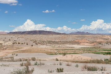 View from shore climate change causing severe drought creates arid dry lake bed within Lake Mead in American desert southwest August 2022