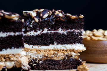 chocolate cake with nut filling and peanuts