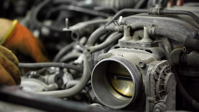 throttle valve. car engine repair. auto repair shop. close-up