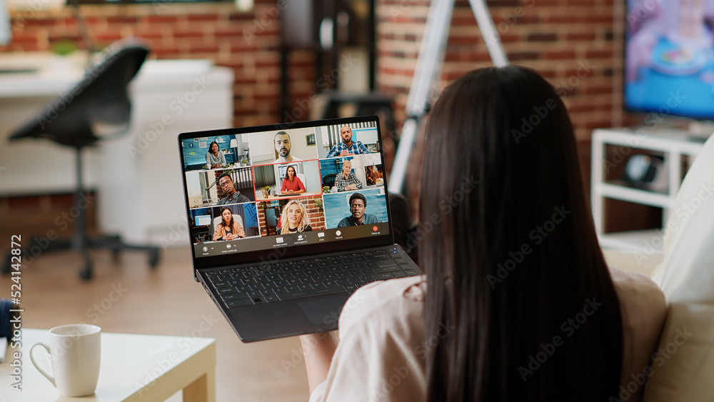 Poster woman working from home while discussing with manager on digital video call conference. young adult 