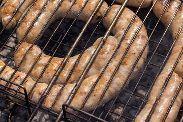 A fire made of logs while cooking barbecue