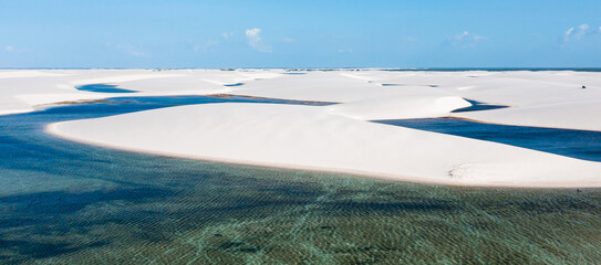 aerial view of the white sand dunes of Lencois Maranhenses with rain water pools