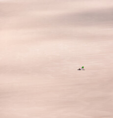 empty beach with one person silhouette