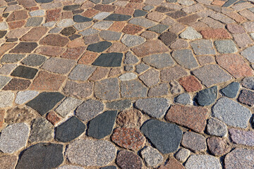 A road paved with made of stones and cobblestones for vacationing people