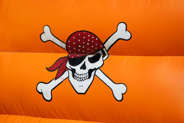 Pirate skull. Inflatable castle in the shape of a pirate ship. Outdoor game for children. Fun for...