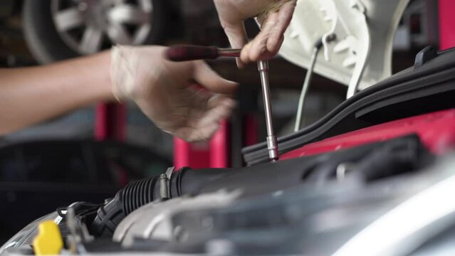 auto mechanic repairs car engine. car service. close-up.