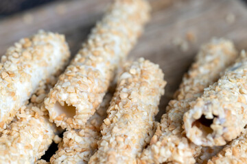 waffle tube with chocolate filling and crushed peanuts